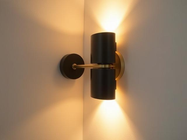 Aplique de pared estilo Bauhaus con formas circulares y rectangulares, luz cálida